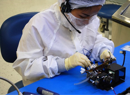 Optics technicians working